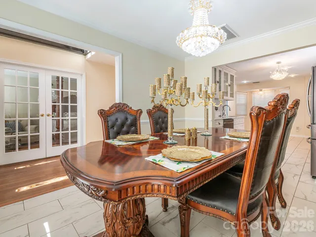 a outdoor dining space with furniture and window