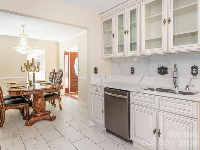 a view of a kitchen with electric appliances and cabinets