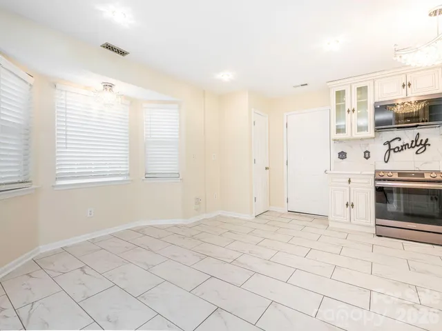 a view of kitchen with furniture and window