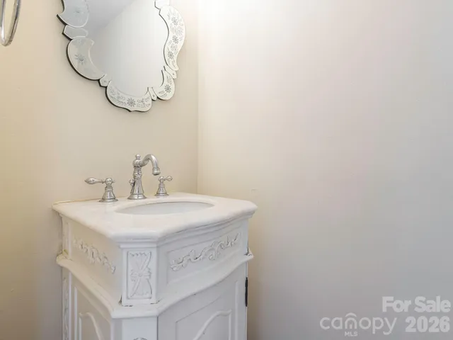 a bathroom with a sink and mirror