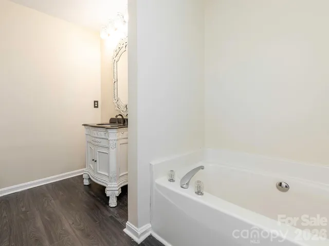 a bathroom with a bathtub and sink