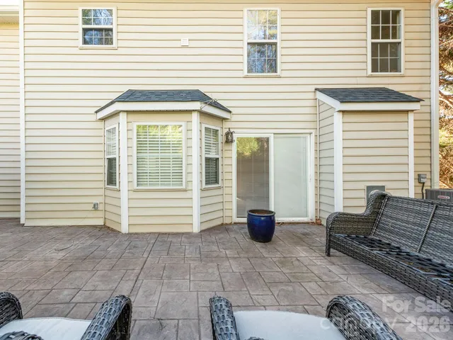 a view of backyard with seating space