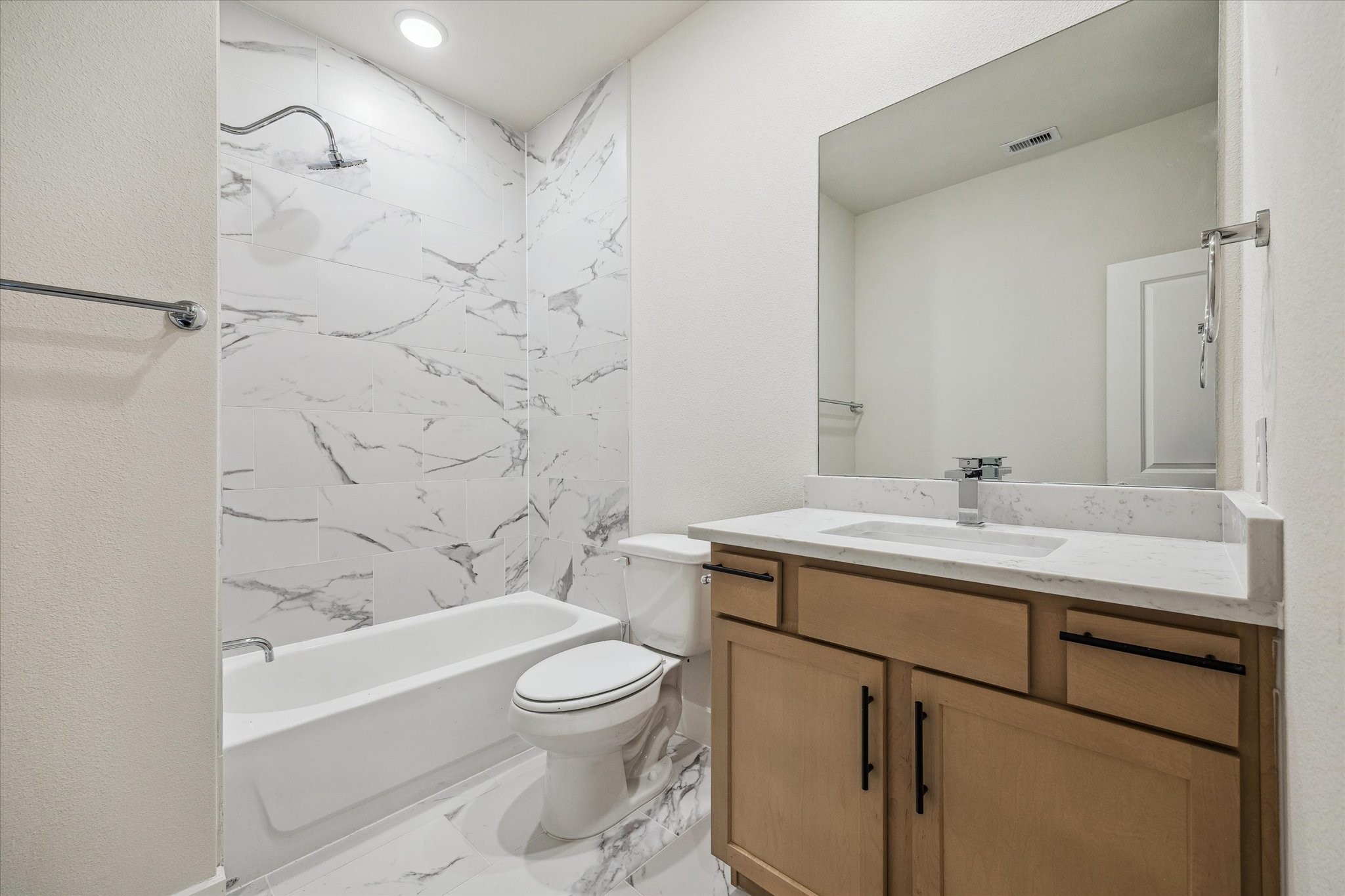 6517 Rena Street Houston, TX 77092 - Photo 11 of 11 a bathroom with a sink toilet vanity and shower