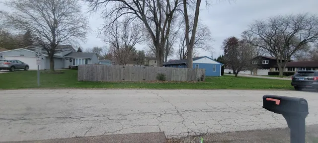a view of a park with large trees