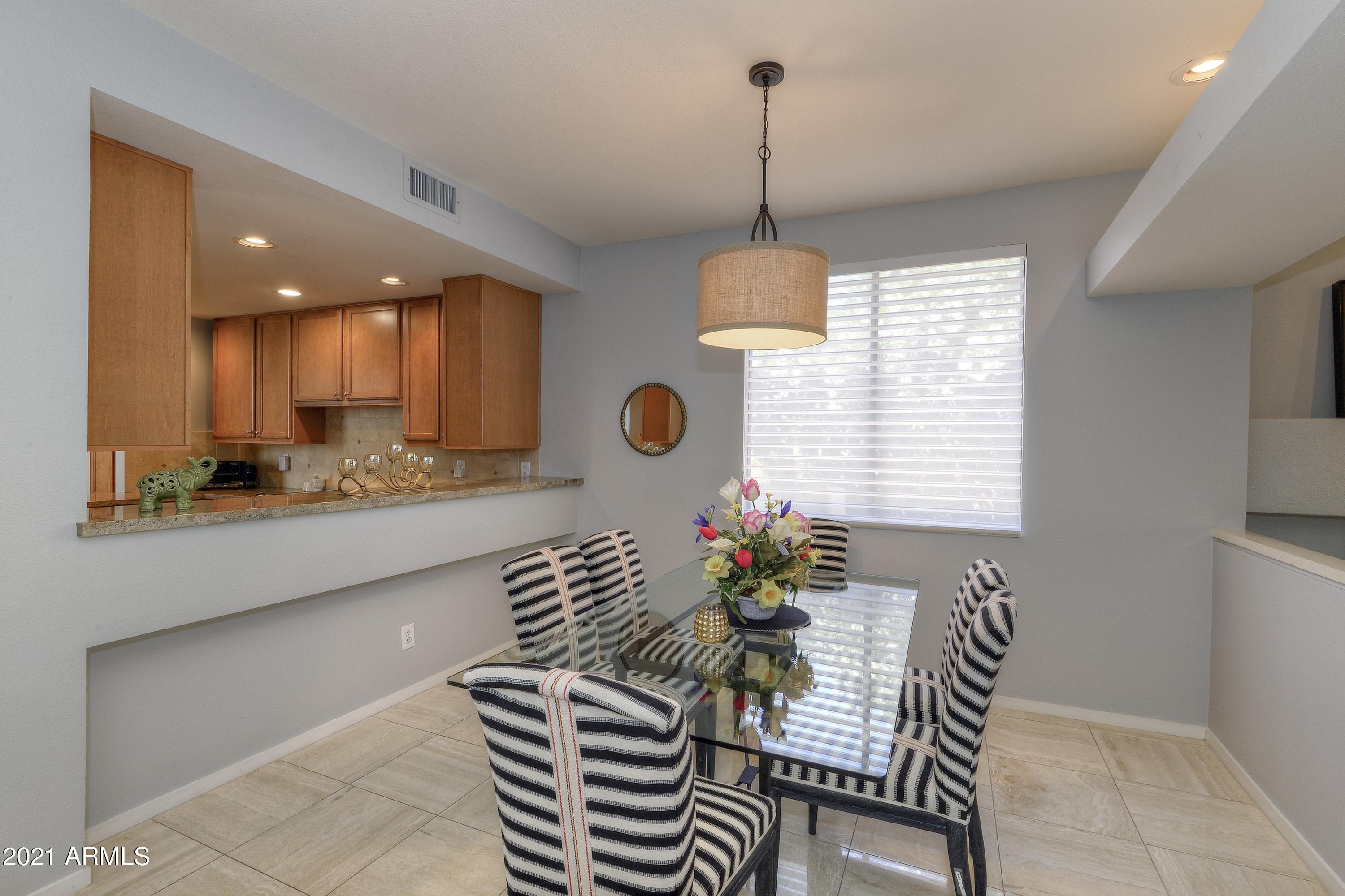 7700 East Gainey Ranch Road, Unit 153 Scottsdale, AZ 85258 - Photo 9 of 14 006_Dining