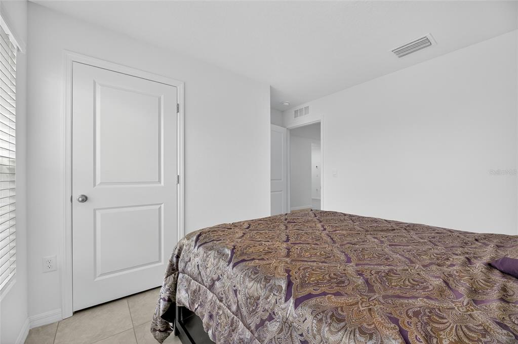 3602 Forest Path Drive Plant City, FL 33565 - Photo 13 of 75 a bedroom with a bed and a cabinets