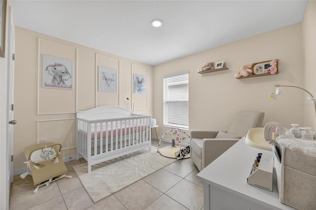 3602 Forest Path Drive Plant City, FL 33565 - Photo 16 of 75 a bedroom with a bed and wooden floor