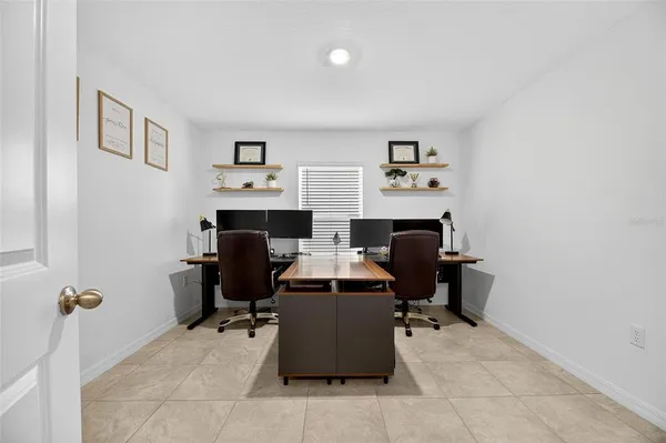 a kitchen with stainless steel appliances kitchen island granite countertop a refrigerator and a stove top oven