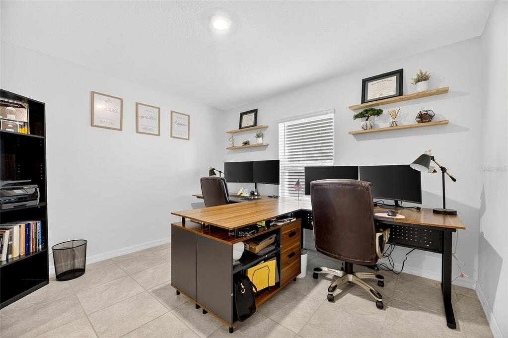 3602 Forest Path Drive Plant City, FL 33565 - Photo 21 of 75 a view of a workspace with furniture and a window