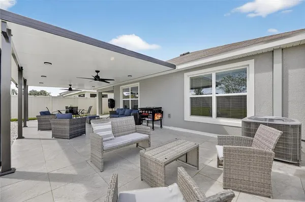 a view of a dining room with furniture window and outdoor kitchen
