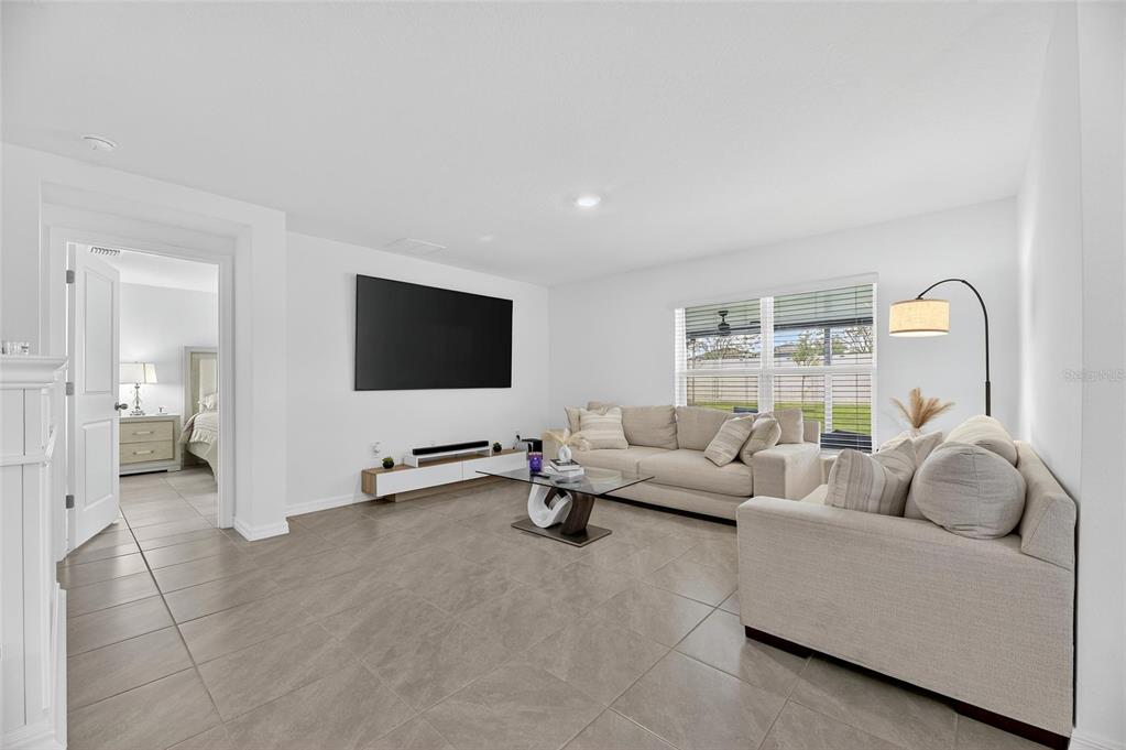 3602 Forest Path Drive Plant City, FL 33565 - Photo 32 of 75 a living room with furniture and a flat screen tv