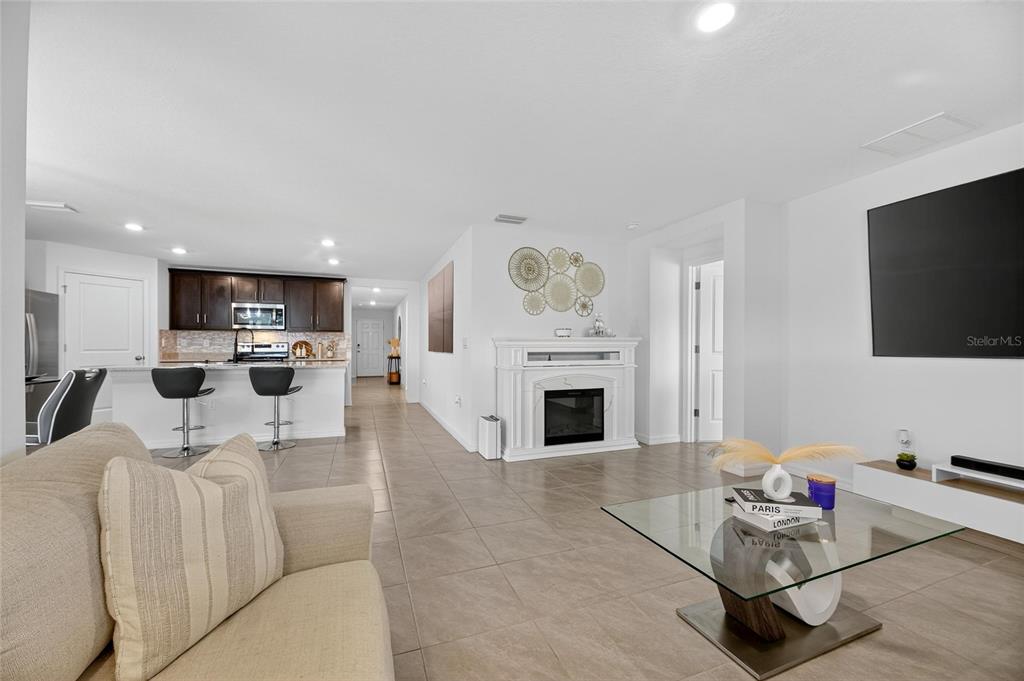 3602 Forest Path Drive Plant City, FL 33565 - Photo 34 of 75 a living room with furniture and a flat screen tv