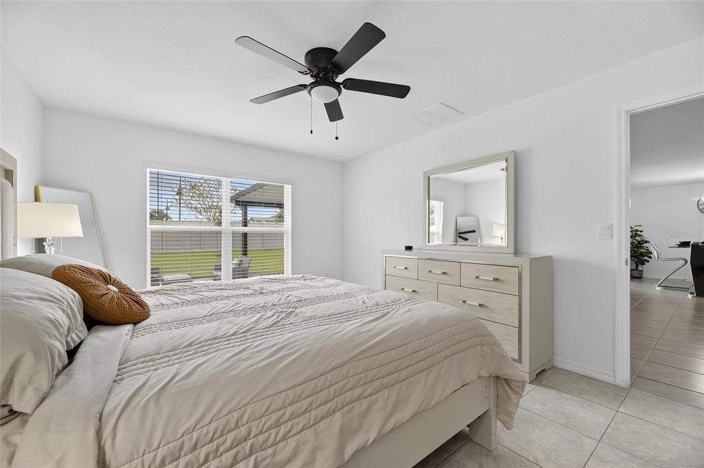 3602 Forest Path Drive Plant City, FL 33565 - Photo 36 of 75 a bedroom with a large bed and a window
