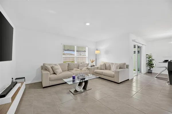 an aerial view of a house with garden space and sitting space