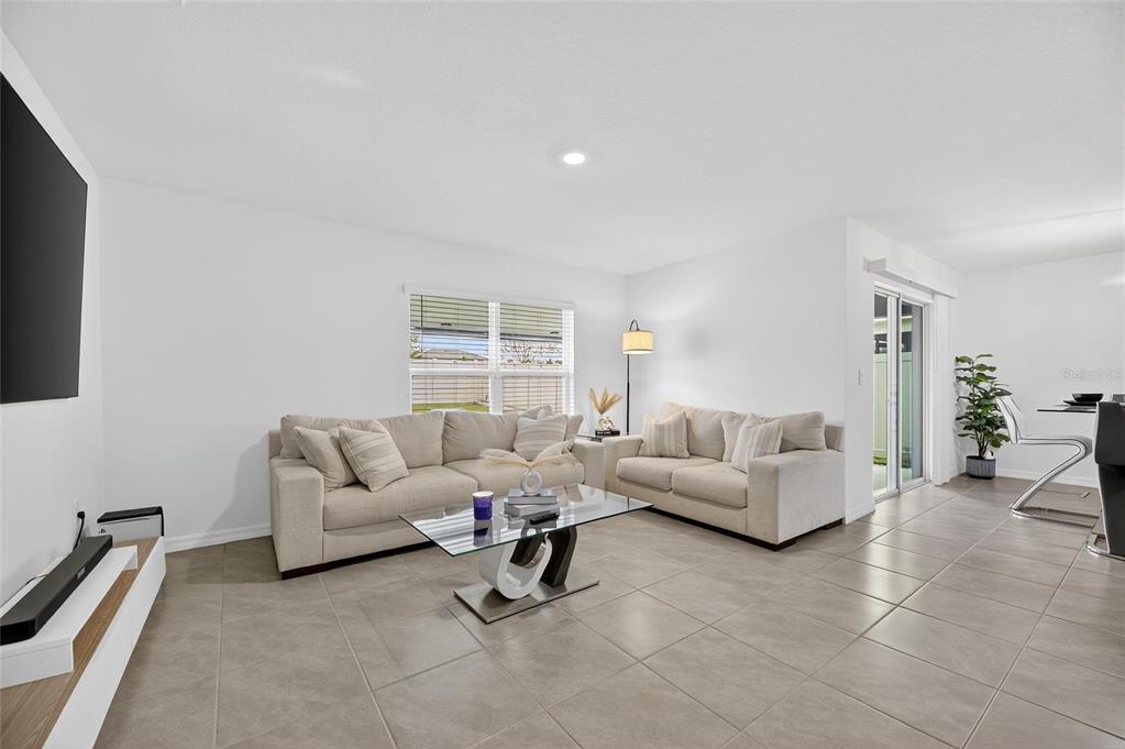 3602 Forest Path Drive Plant City, FL 33565 - Photo 43 of 75 a living room with furniture and a flat screen tv