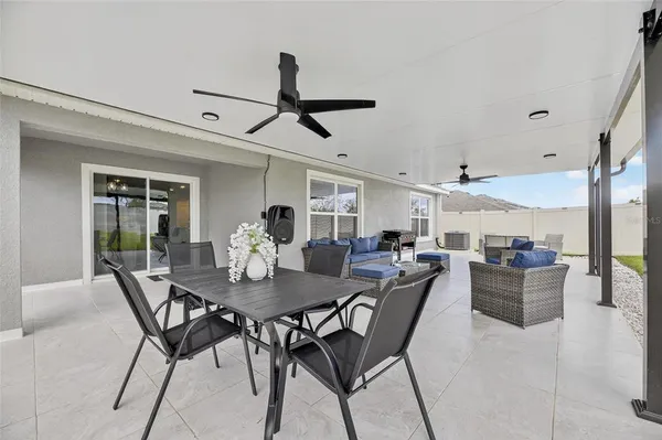 an aerial view of a house with swimming pool and outdoor space