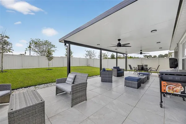 an aerial view of a house with yard swimming pool and outdoor seating
