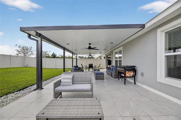 an aerial view of multiple houses with yard