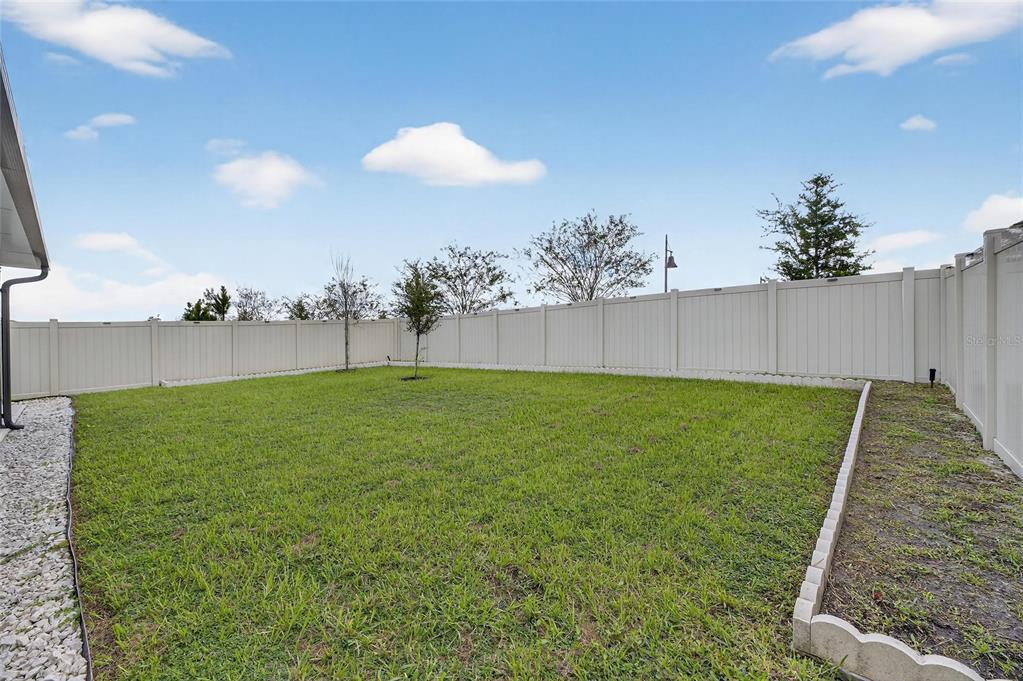 3602 Forest Path Drive Plant City, FL 33565 - Photo 52 of 75 a view of yard with swimming pool and seating