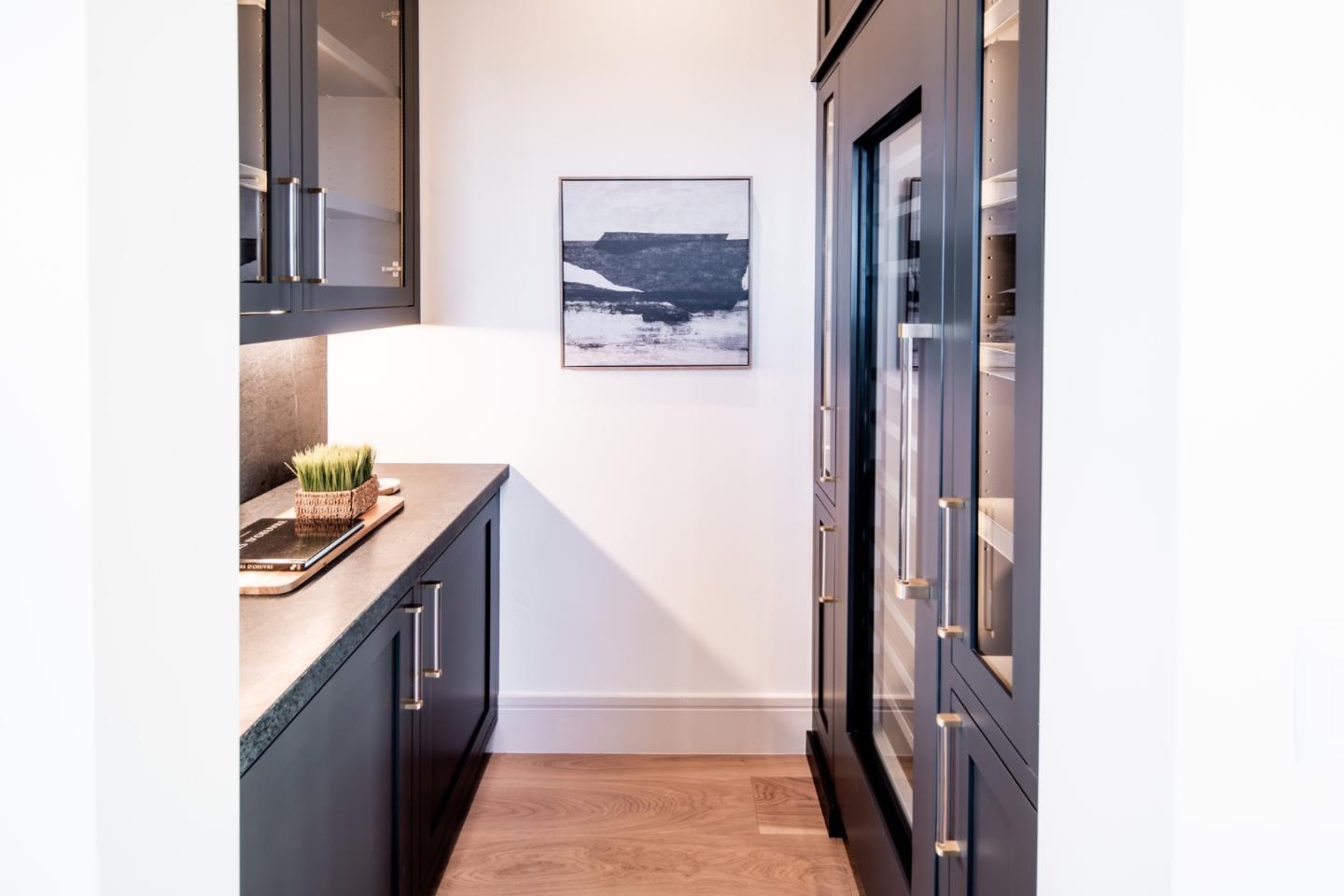8210 Manjares Road Monterey, CA 93940 - Photo 15 of 76 a hallway with two painting on the wall and a large mirror