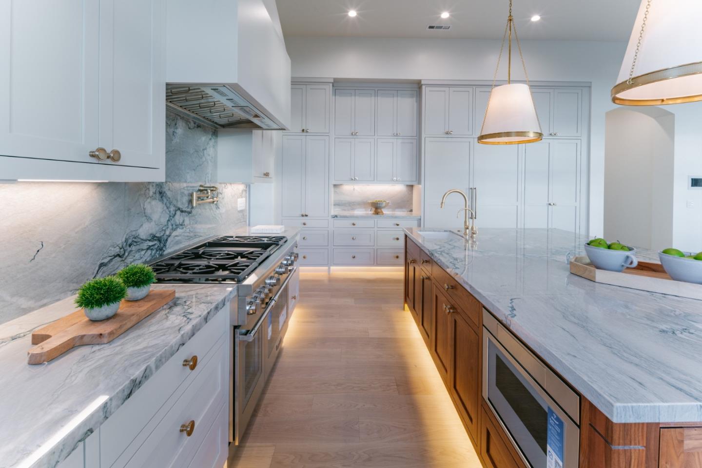 8210 Manjares Road Monterey, CA 93940 - Photo 22 of 76 a large kitchen with stainless steel appliances granite countertop a lot of counter space and wooden floor