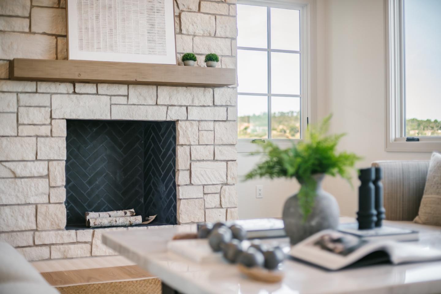 8210 Manjares Road Monterey, CA 93940 - Photo 29 of 76 a living room with furniture and a fireplace