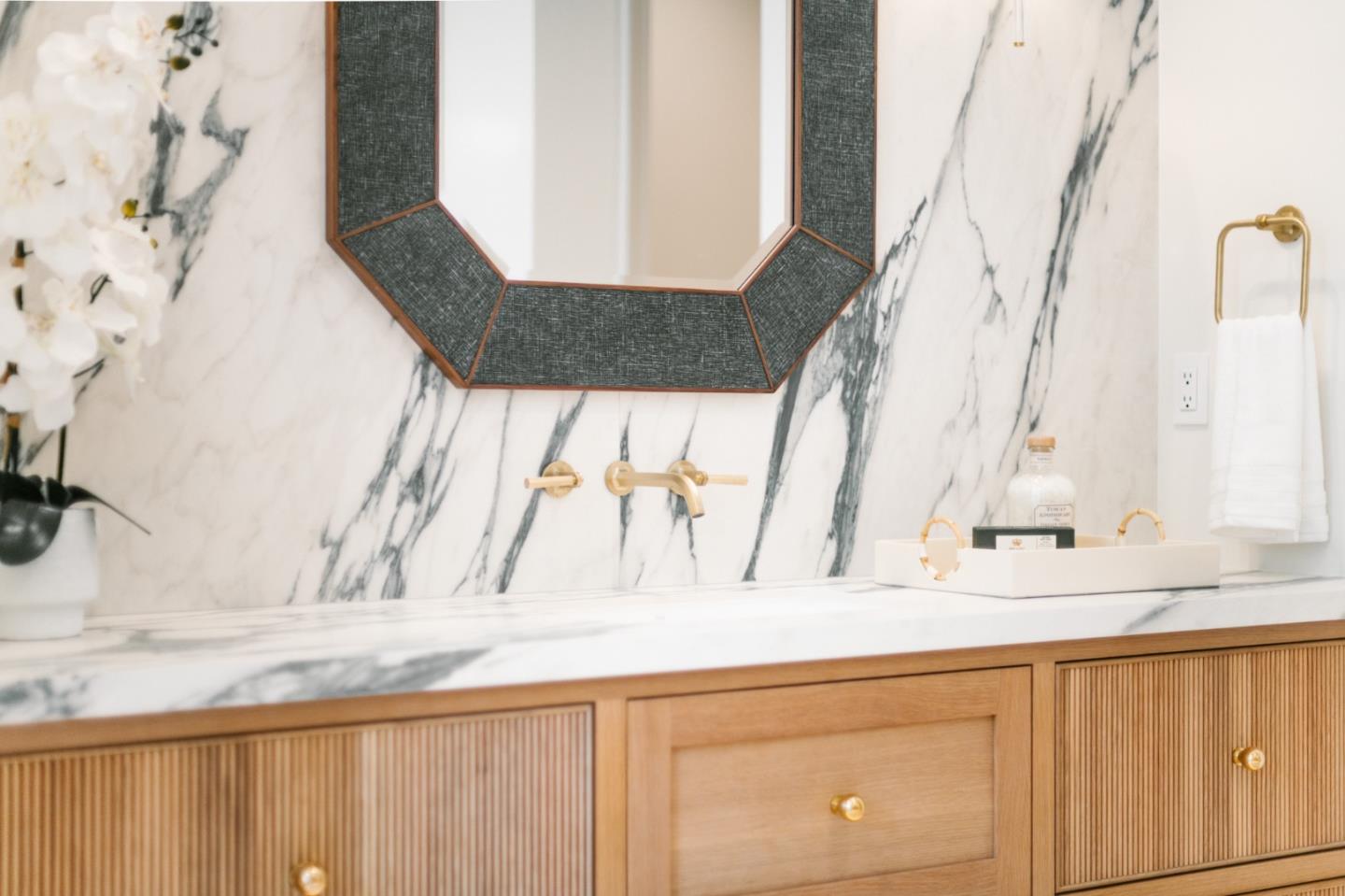8210 Manjares Road Monterey, CA 93940 - Photo 46 of 76 a bathroom with a granite countertop sink and a mirror