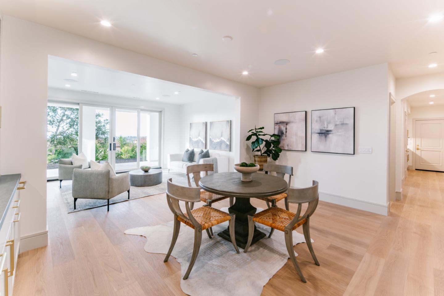 8210 Manjares Road Monterey, CA 93940 - Photo 59 of 76 a view of a dining room with furniture and wooden floor