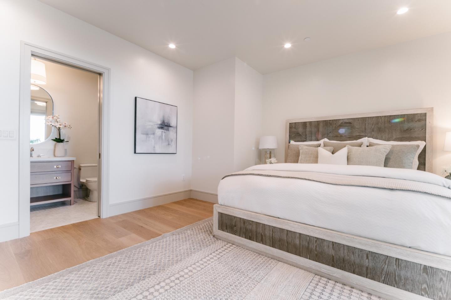 8210 Manjares Road Monterey, CA 93940 - Photo 63 of 76 a bedroom with a bed and a lamp