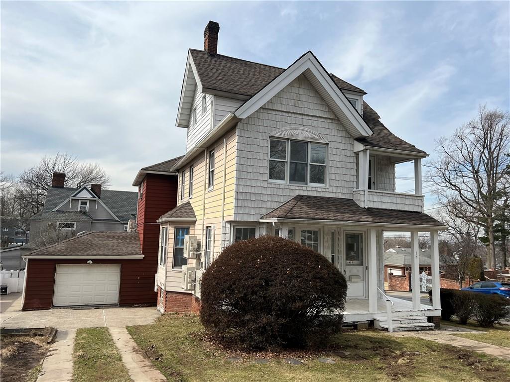 212 Manor Road Staten Island, NY 10314 - Photo 1 of 12 a front view of a house with a yard