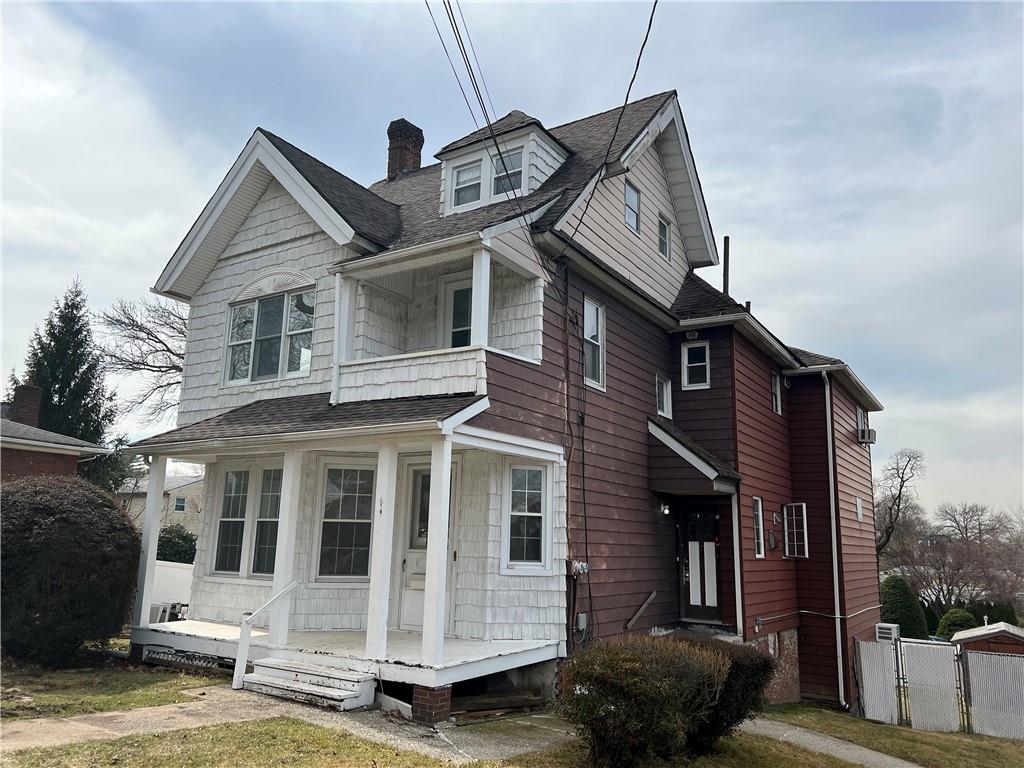 212 Manor Road Staten Island, NY 10314 - Photo 2 of 12 a front view of a house with a garden