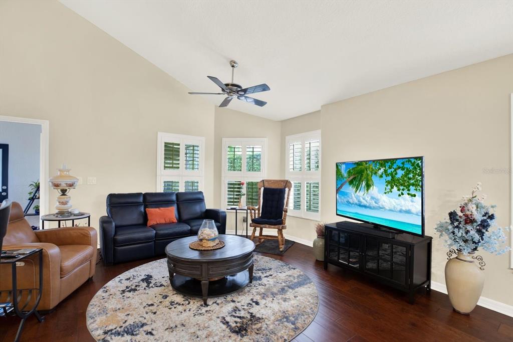 2021 Meadow Rue Court Trinity, FL 34655 - Photo 7 of 41 a living room with furniture a window and a flat screen tv
