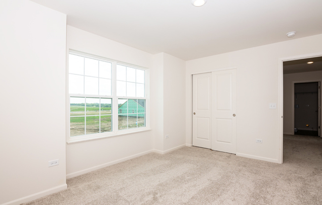 3628 Edelweiss Road Elgin, IL 60124 - Photo 12 of 38 an empty room with windows