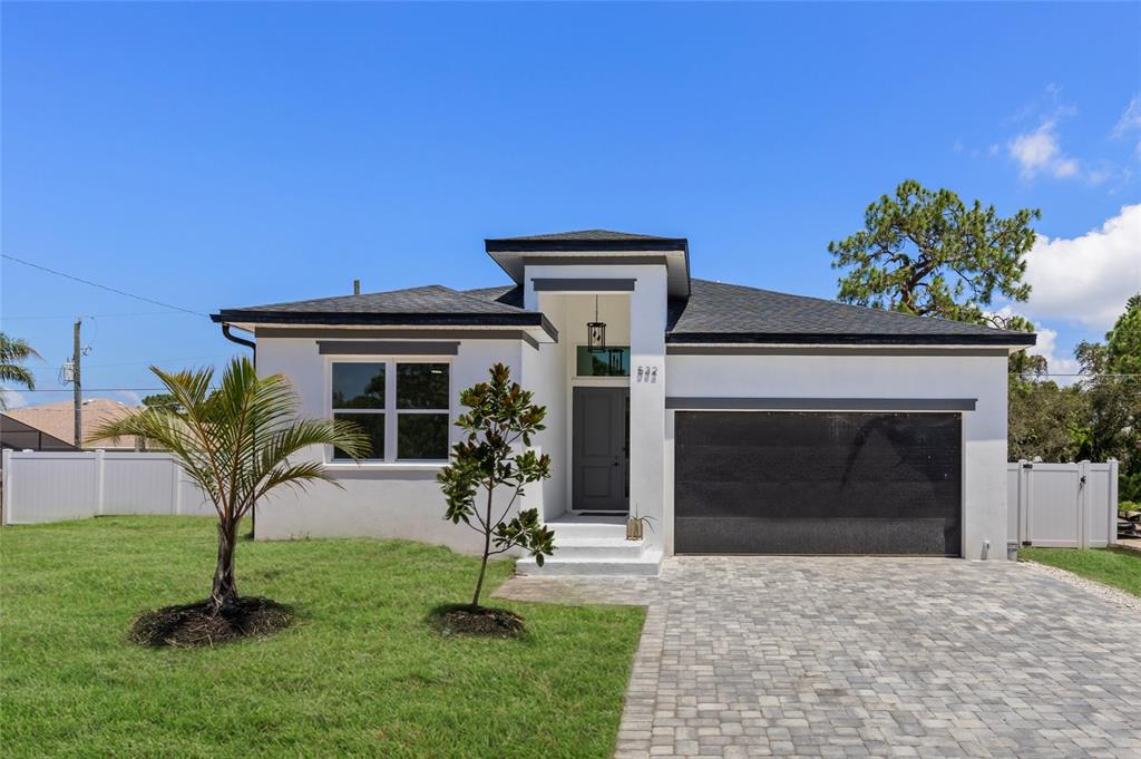 532 Yale Road Venice, FL 34293 - Photo 1 of 1 a front view of a house with a garden and plants