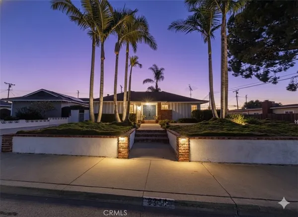 a swimming pool with outdoor seating and yard