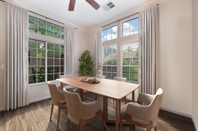a view of a dining room with furniture window and outside view