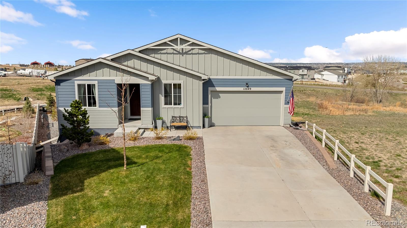 12649 Buffington Trail Parker, CO 80134 - Photo 1 of 47 a front view of a house with swimming pool
