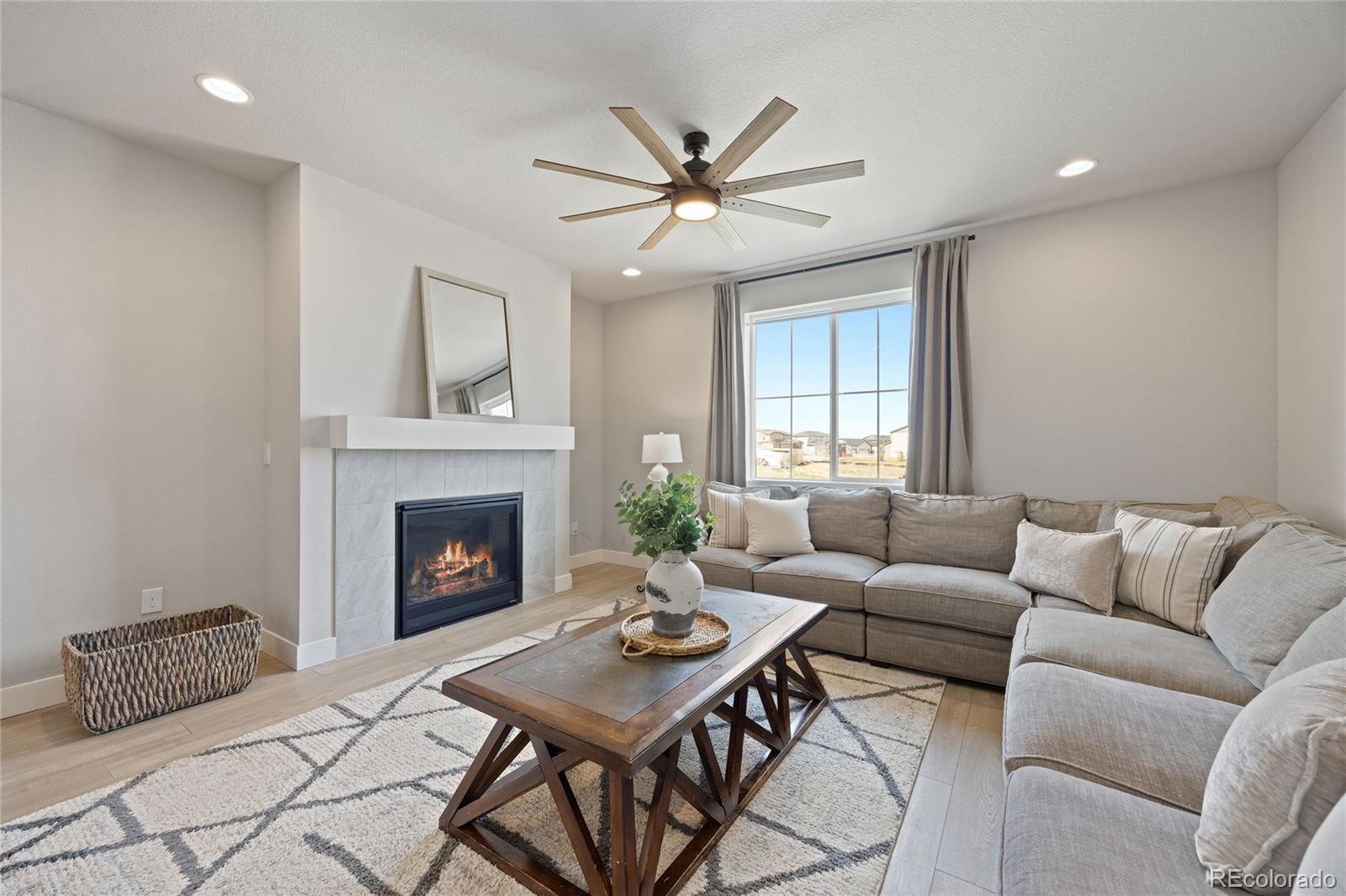 12649 Buffington Trail Parker, CO 80134 - Photo 13 of 47 a living room with furniture and a fireplace
