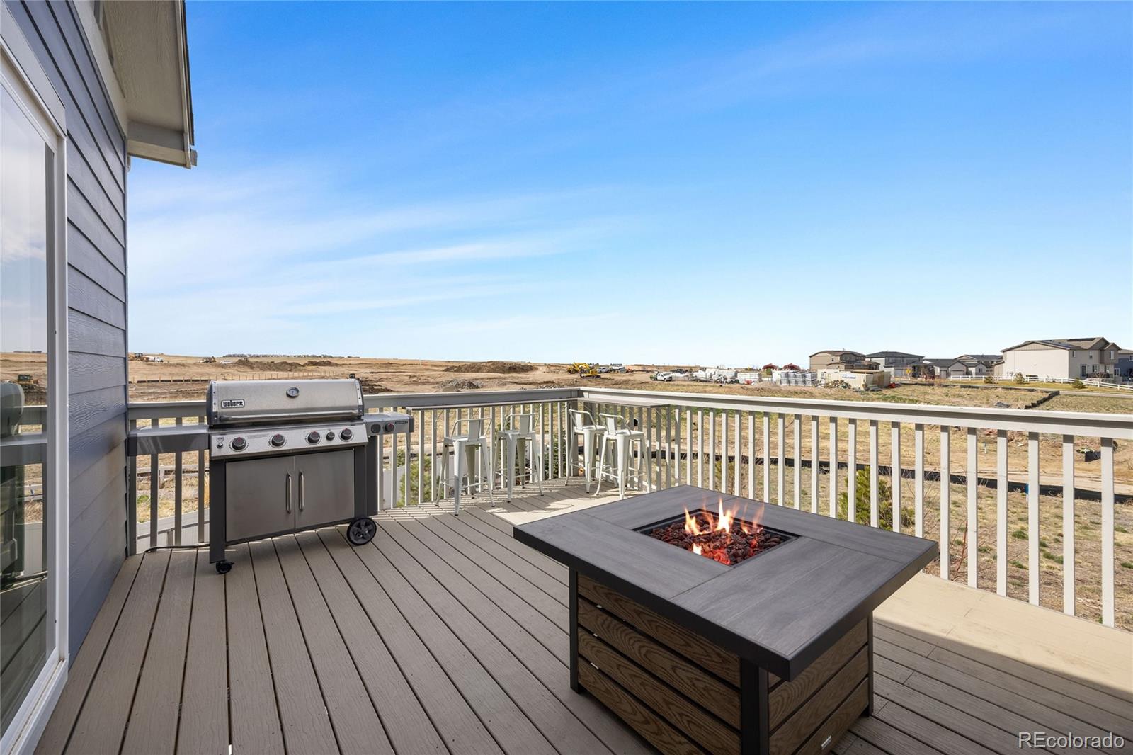 12649 Buffington Trail Parker, CO 80134 - Photo 17 of 47 a balcony with wooden floor and city view