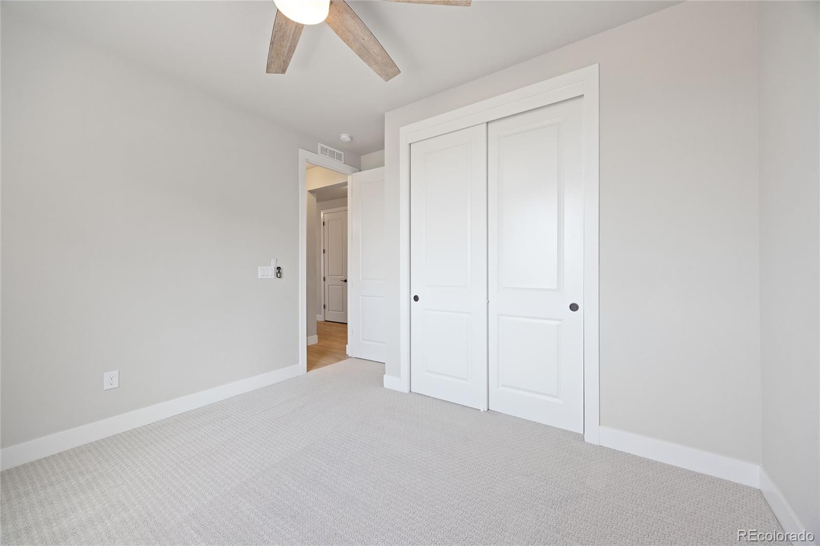 12649 Buffington Trail Parker, CO 80134 - Photo 28 of 47 a view of an empty room and a ceiling fan