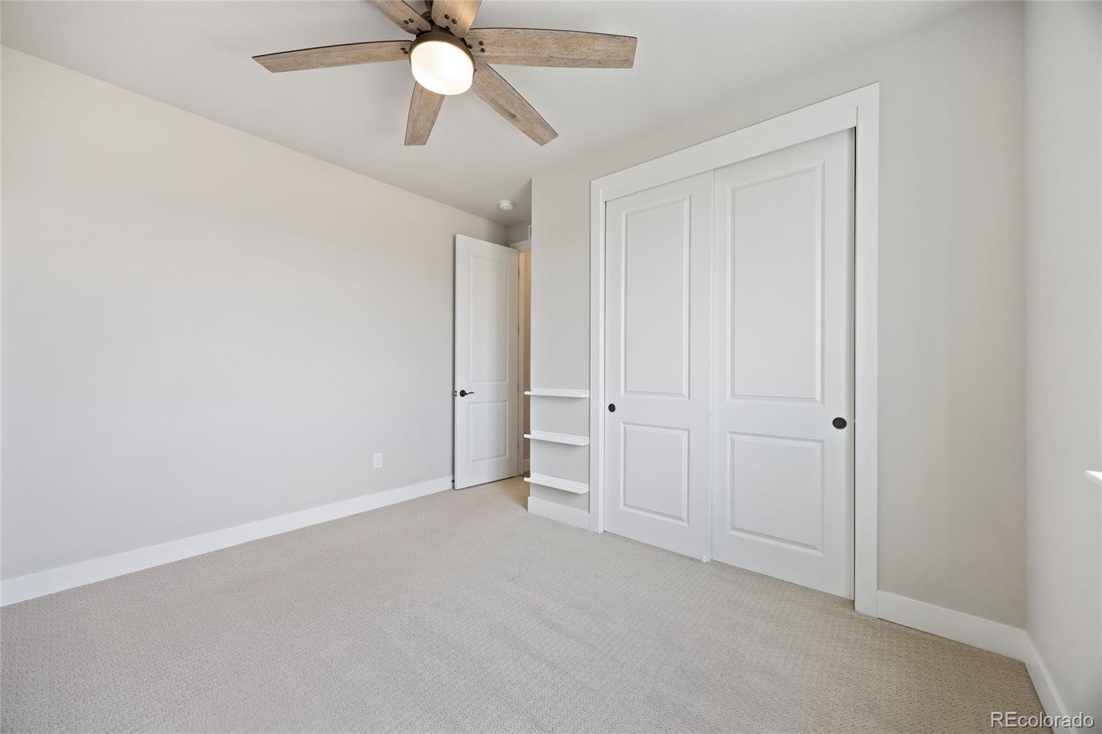 12649 Buffington Trail Parker, CO 80134 - Photo 31 of 47 a view of an empty room and chandelier fan