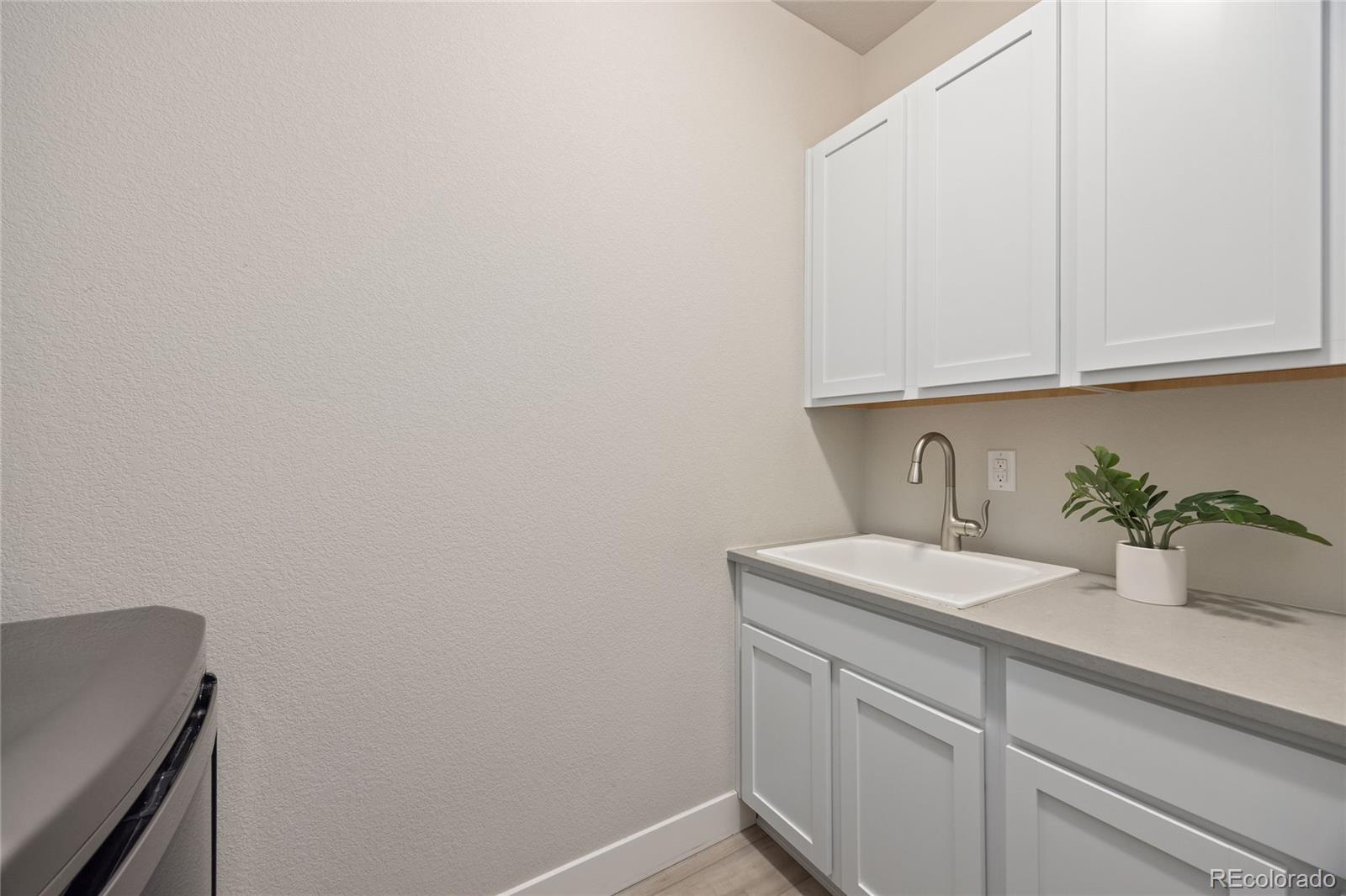 12649 Buffington Trail Parker, CO 80134 - Photo 32 of 47 a bathroom with a sink and vanity