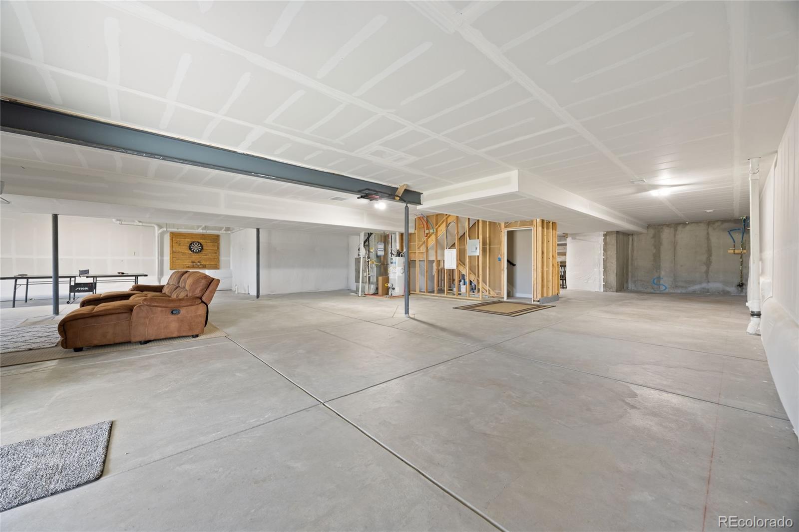 12649 Buffington Trail Parker, CO 80134 - Photo 33 of 47 a view of a livingroom with furniture and a ceiling fan