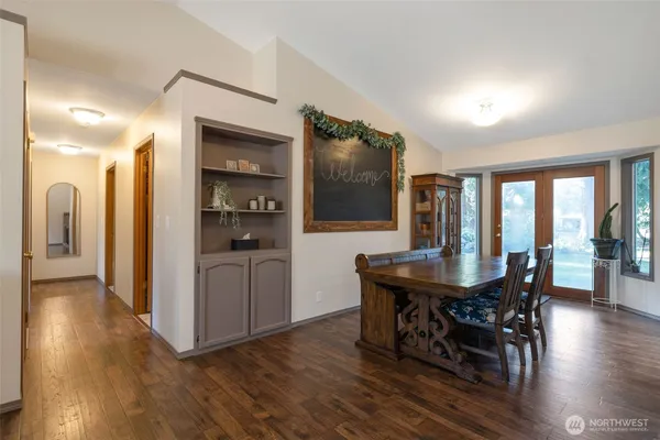 a view of a dining room with furniture and wooden floor