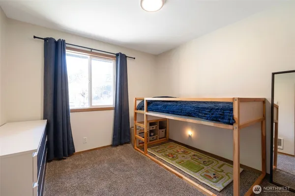 a view of room with a fireplace and a window