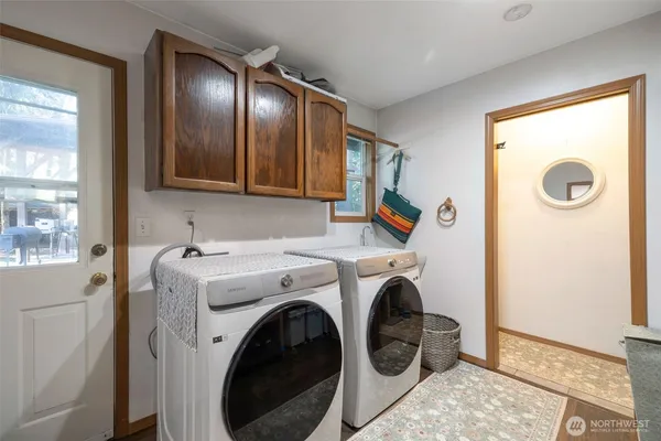 a view of livingroom with washer and dryer