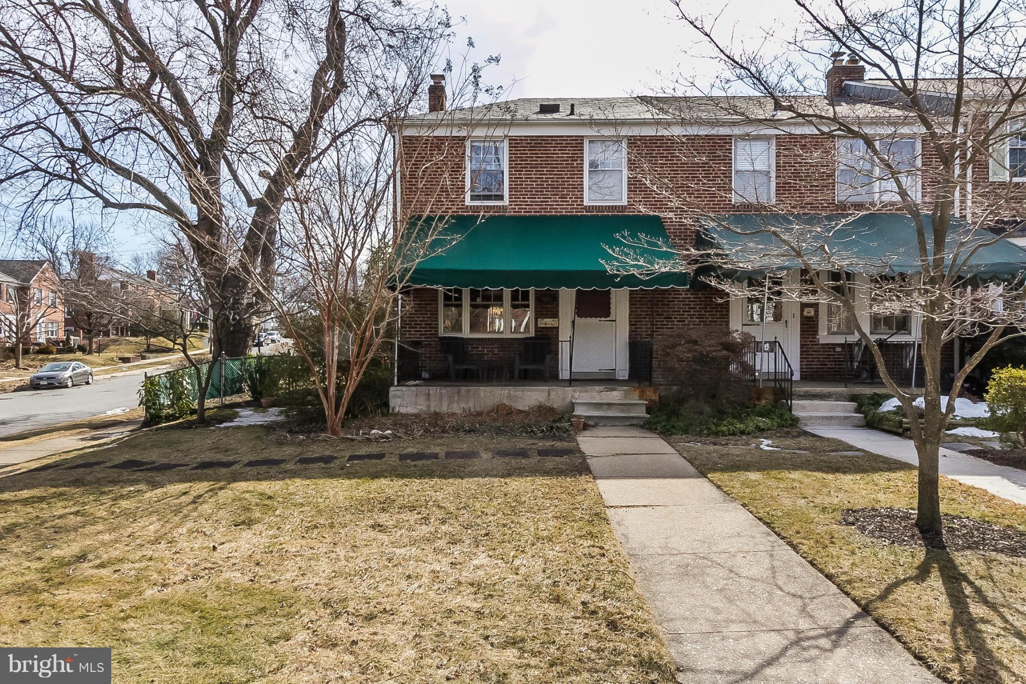 7051 Heathfield Road Baltimore, MD 21212 - Photo 1 of 17 a front view of a house with a yard