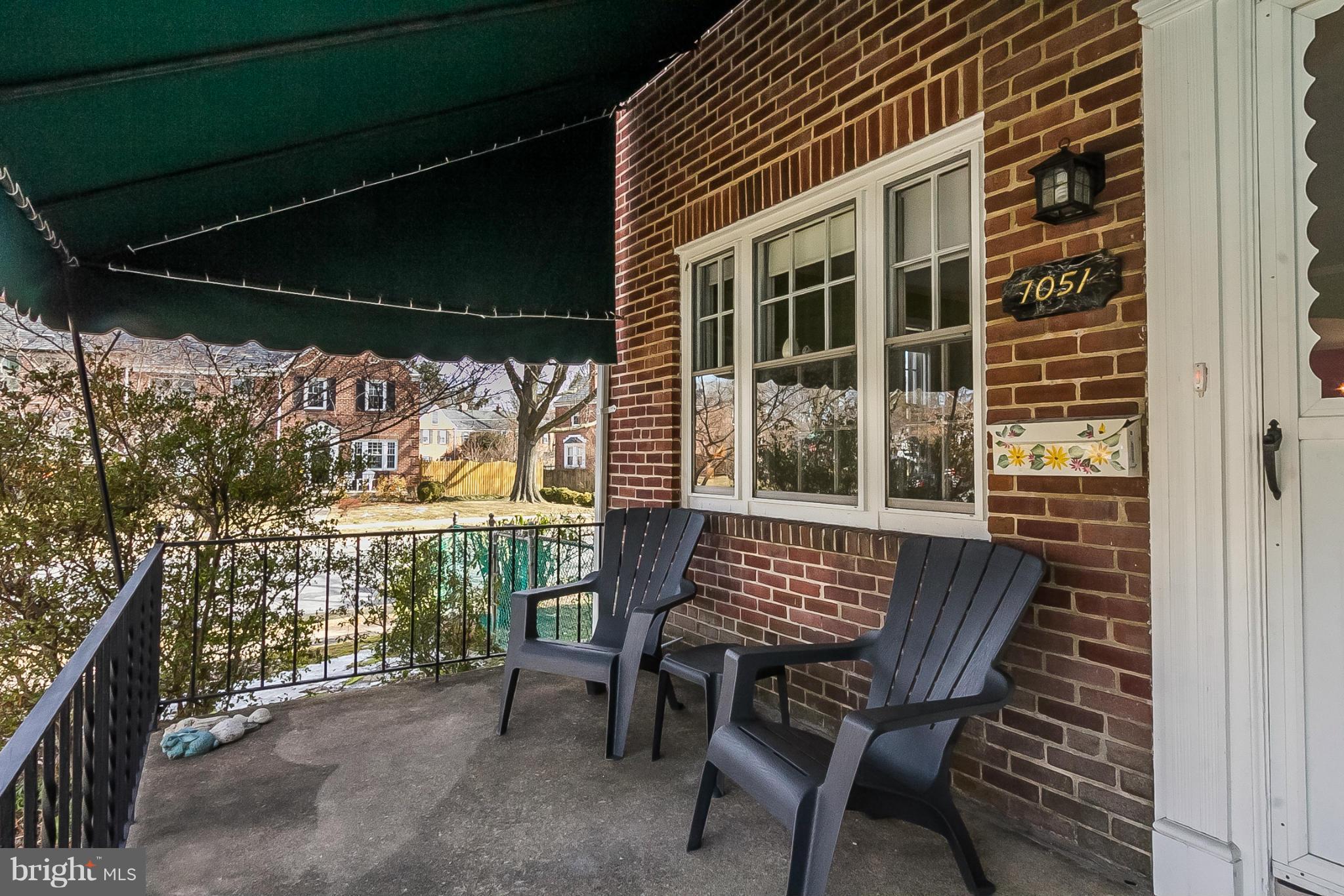 7051 Heathfield Road Baltimore, MD 21212 - Photo 2 of 17 a view of balcony with a table and chairs