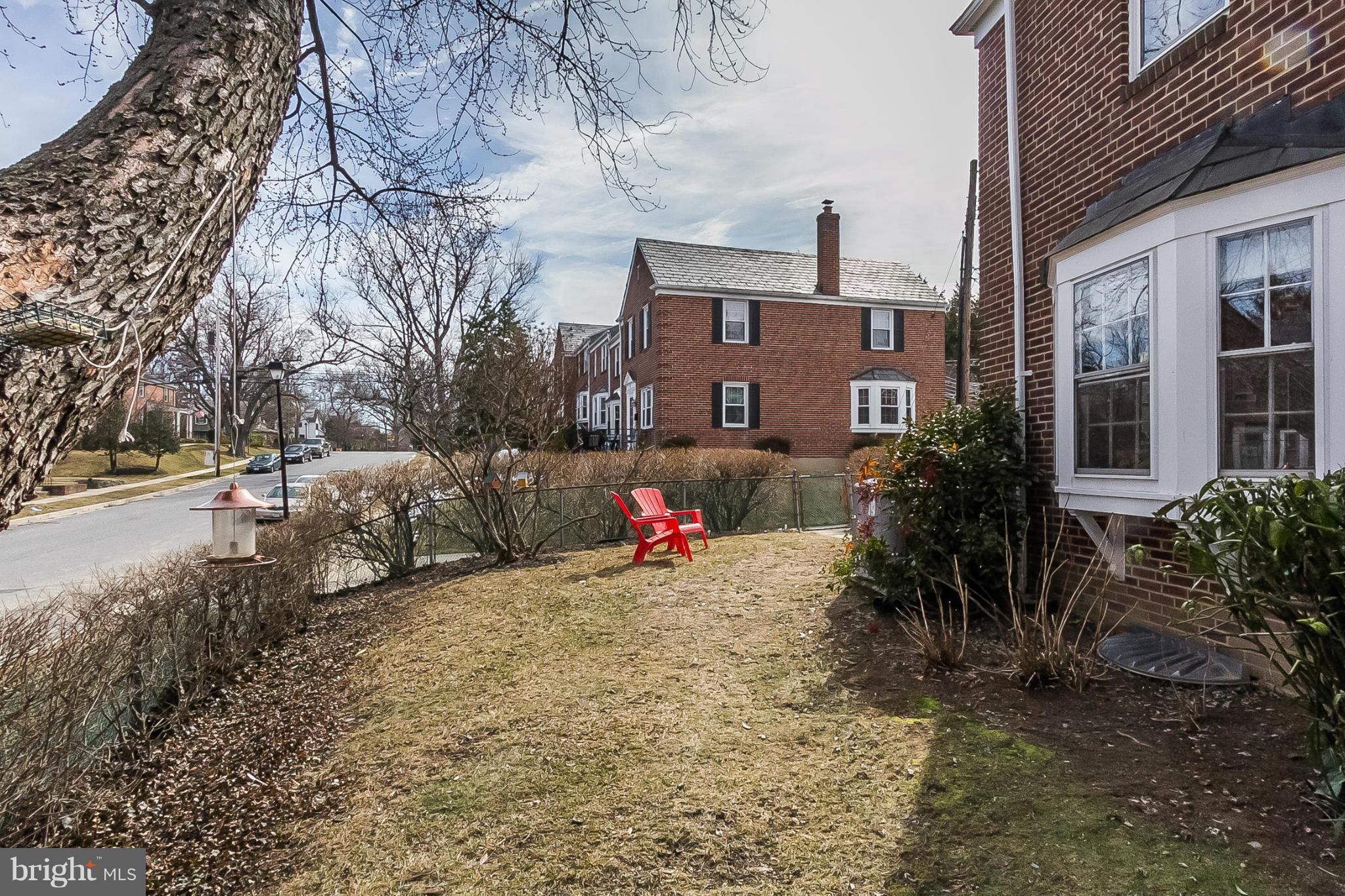 7051 Heathfield Road Baltimore, MD 21212 - Photo 16 of 17 a view of a backyard with a tree