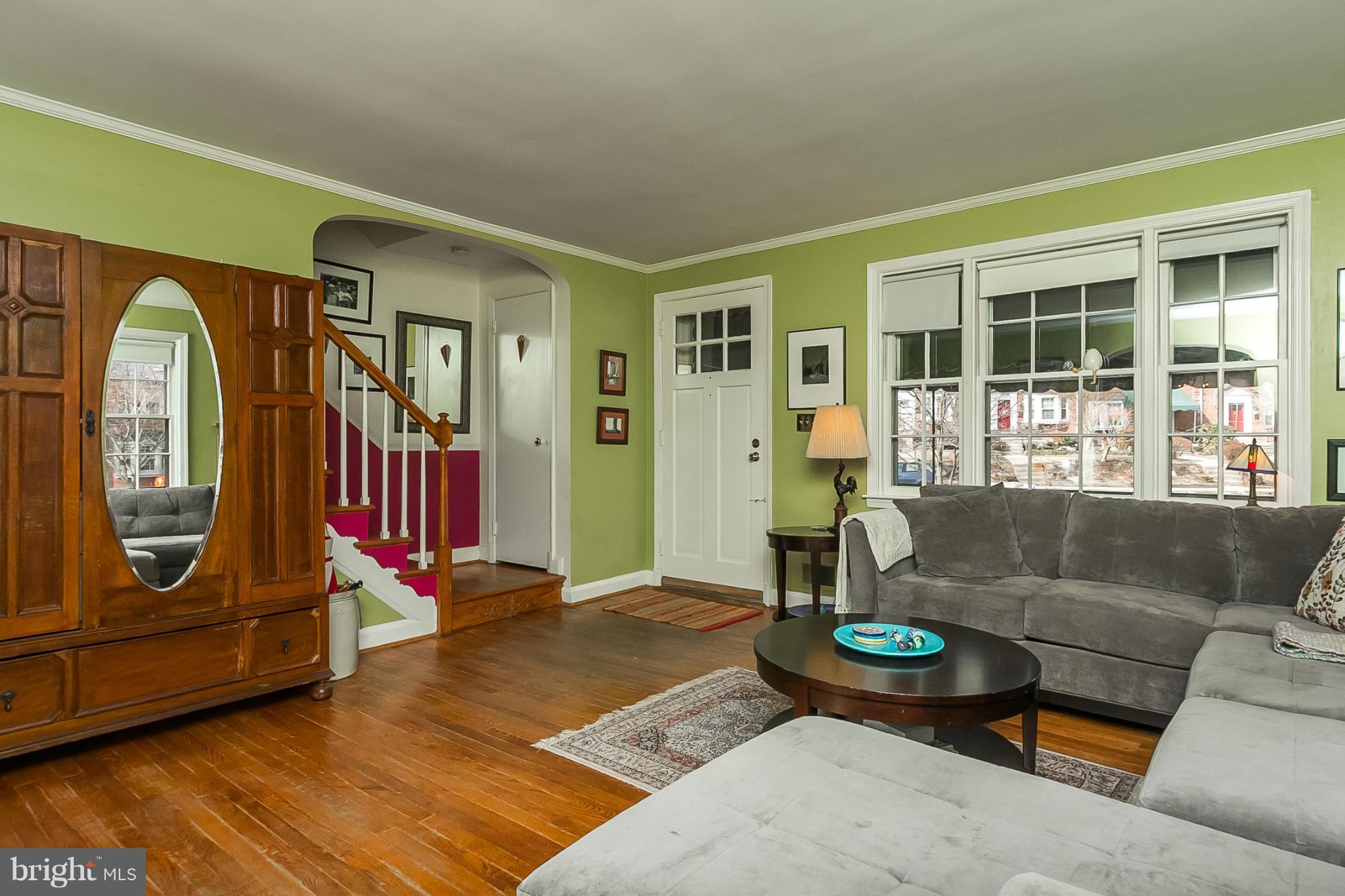 7051 Heathfield Road Baltimore, MD 21212 - Photo 3 of 17 a living room with furniture and a fireplace